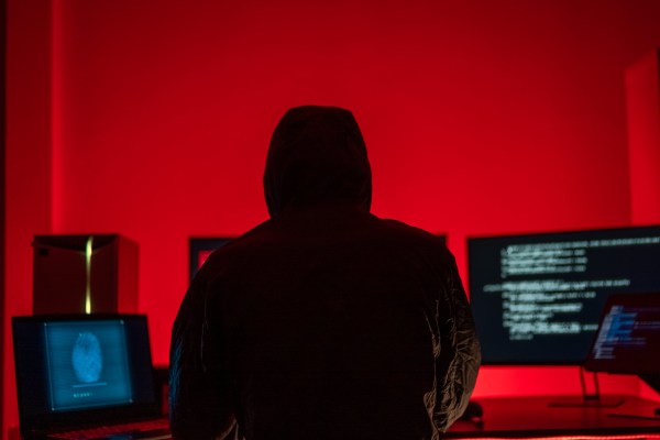 Hackers work secretly in secret rooms. Mysterious colored lights Breaking into personal security and various agencies in the world . Wanted Hacker using computer for hacking in the cyber data center .