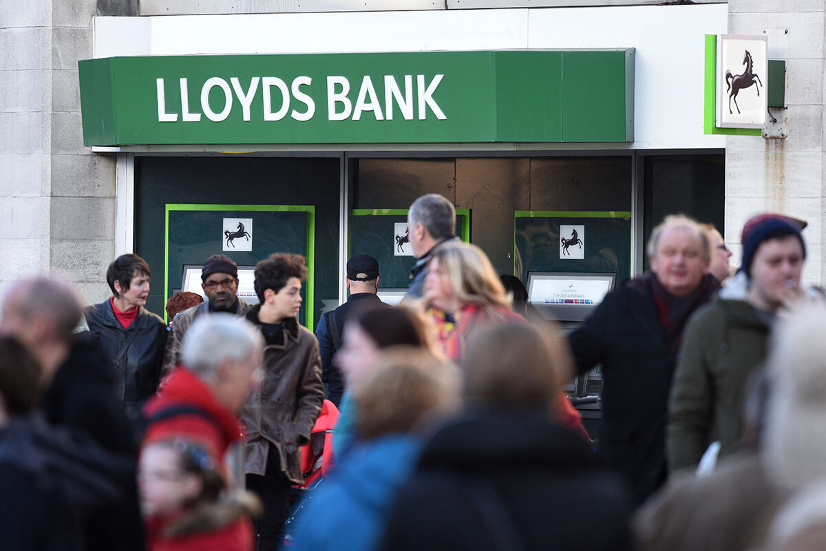 People walking past a Lloyds Bank branch