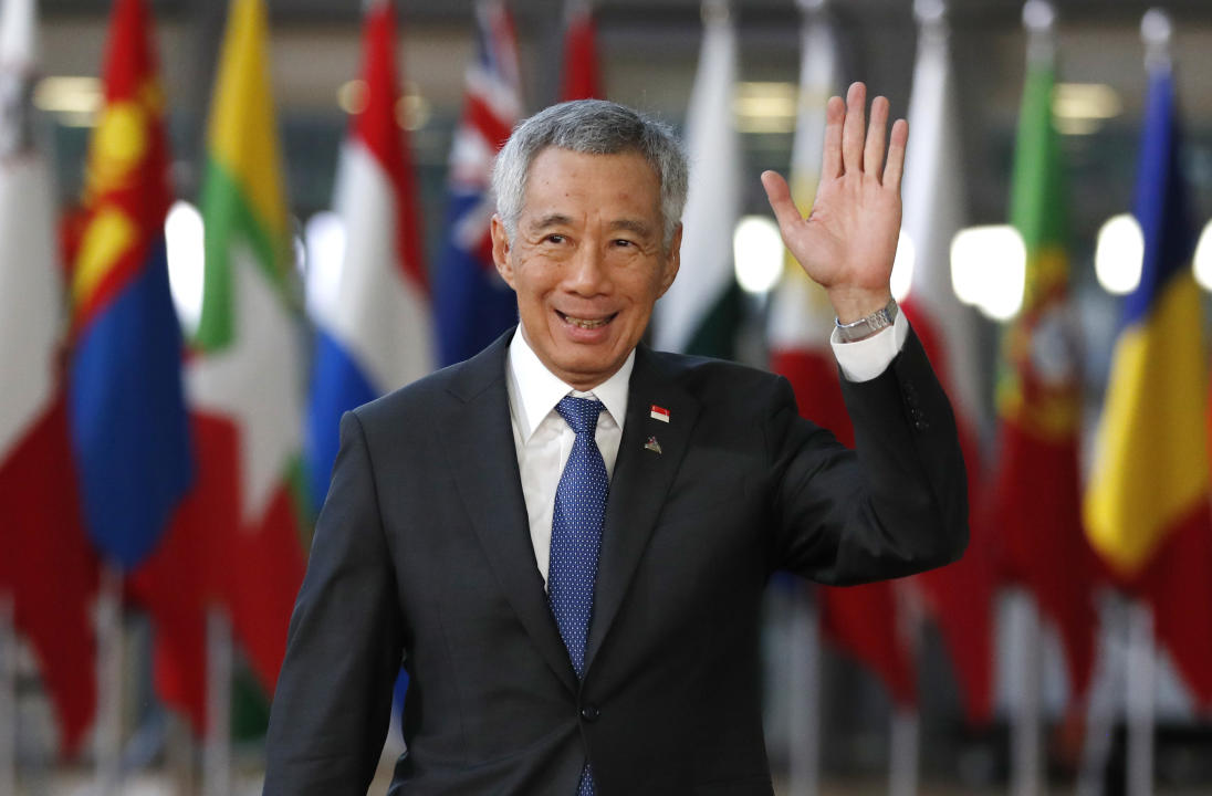 Singapore's Prime Minister Lee Hsien Loong arrives for the ASEM 12 in Brussels, Thursday, Oct. 18, 2018. The informal meeting, which is held every two years, will discuss peace moves on the Korean Peninsula, migration, cybersecurity, fighting extremism and combating climate change. (AP Photo/Alastair Grant)