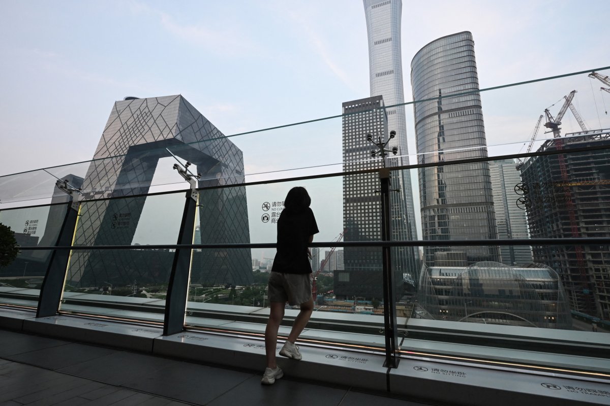 Woman Looks at Beijing Skyline